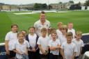 INSPIRED PUPILS: Peter Siddle with pupils from St Peter's Primary School