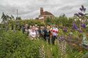 Colourful - the Anglia in Bloom judges during their tour in Frinton