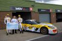 RIGHTEOUS RACERS: Endurance racers Will (right) and Sam (left) present a fundraising cheque to a representative from Addenbrooke's Charitable Trust.