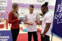 Max Whitlock (centre), Georgia-Mae Fenton (left) and Courtney Tulloch at the South Essex Gymnastics Club (PA)