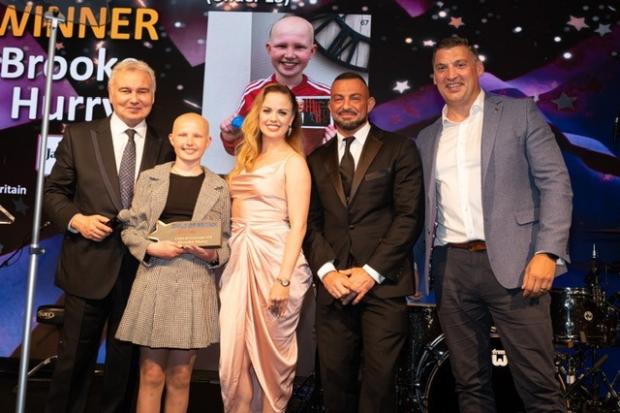 Winner - Brooke on stage at the Child of Britain award