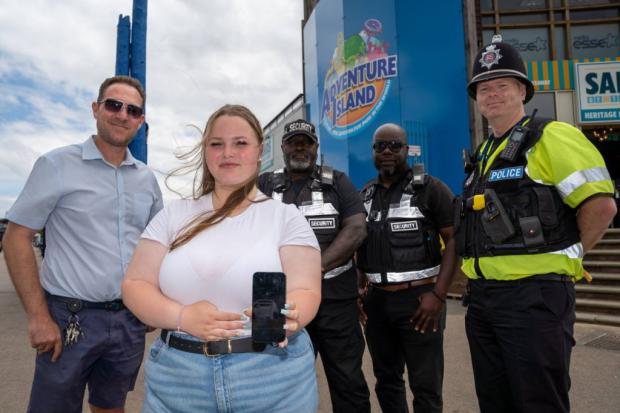 Kelsey Brown (front) with Adventure Island managing director Marc Miller (left), Sergeant James Mint (right) and two of the park's security team. Photo: Essex Police