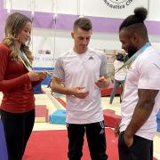 Max Whitlock (centre), Georgia-Mae Fenton (left) and Courtney Tulloch at the South Essex Gymnastics Club (PA)