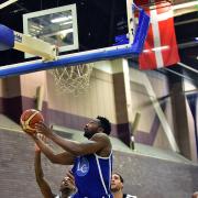 Fly time - David Ajumobi shoots a hoop against the Lions